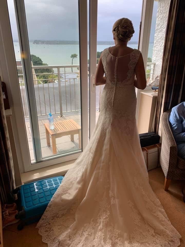 The bride looking out onto the beach