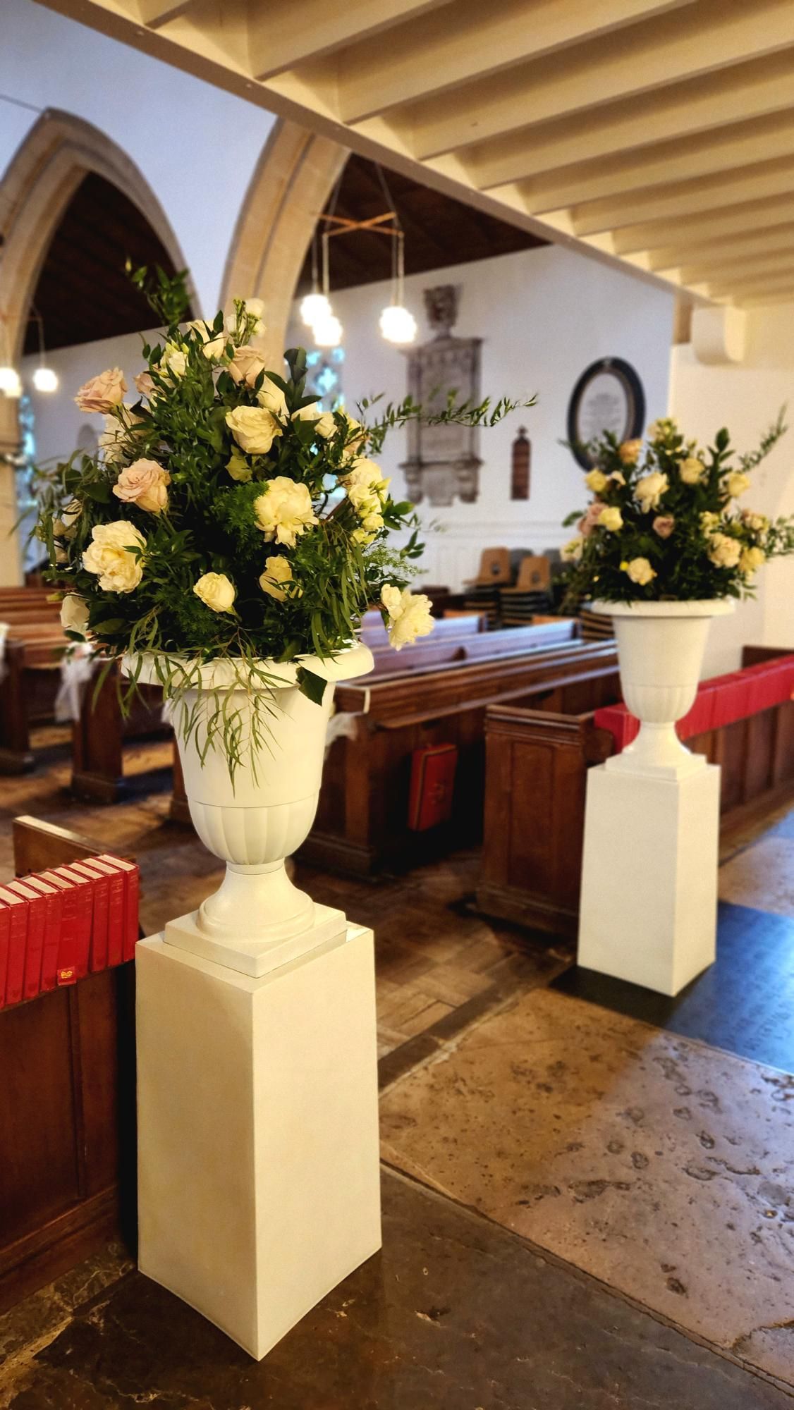 Pedestal flowers with fresh white roses