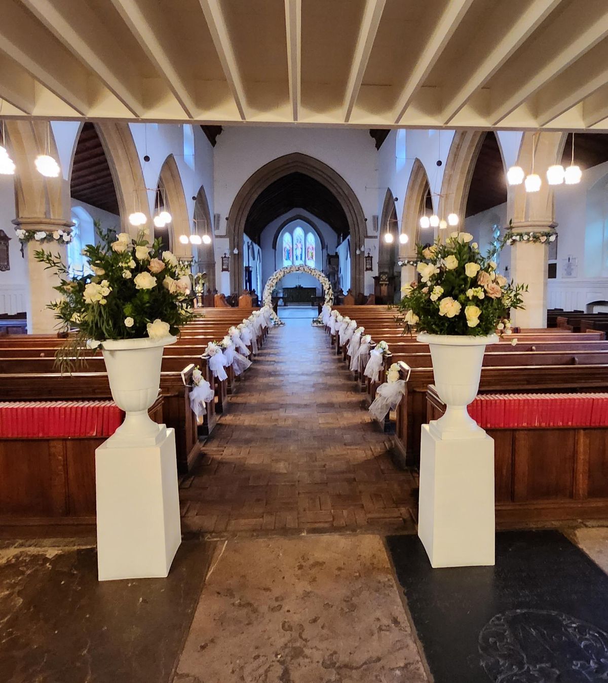 Pedestal flowers with fresh white roses