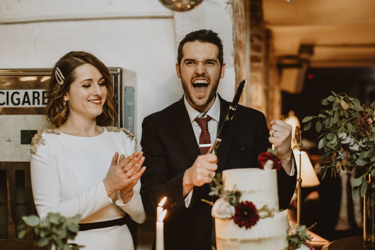 Adam & Jessica cake cutting moment