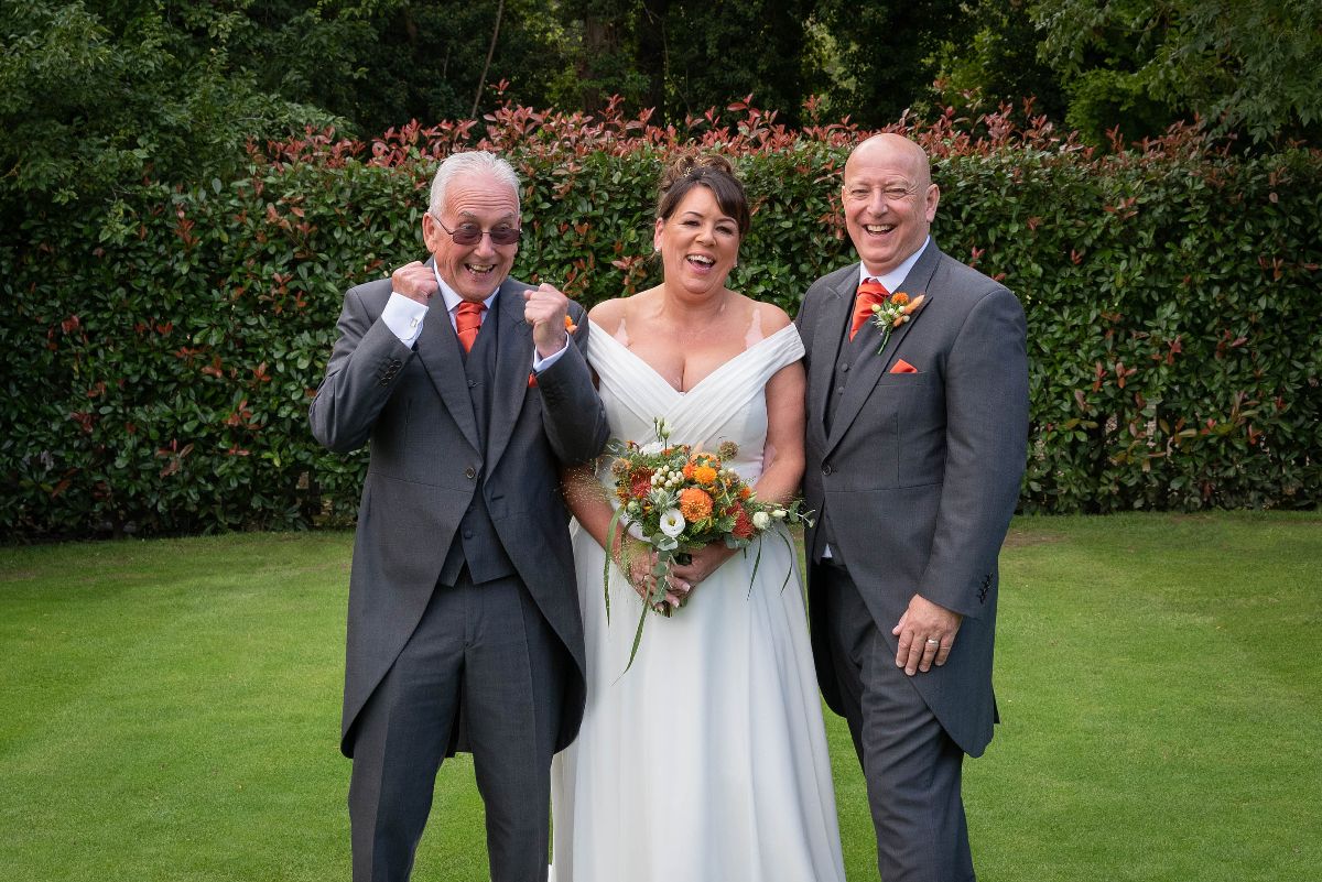 The father of the bride elated that he had finally given his daughter away!