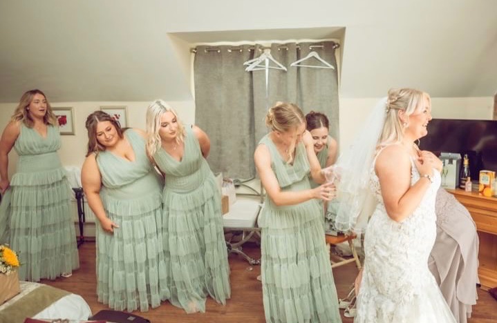 Bride and her bridesmaids getting ready.