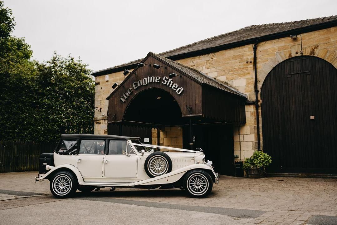 A vintage wedding car arriving in style!